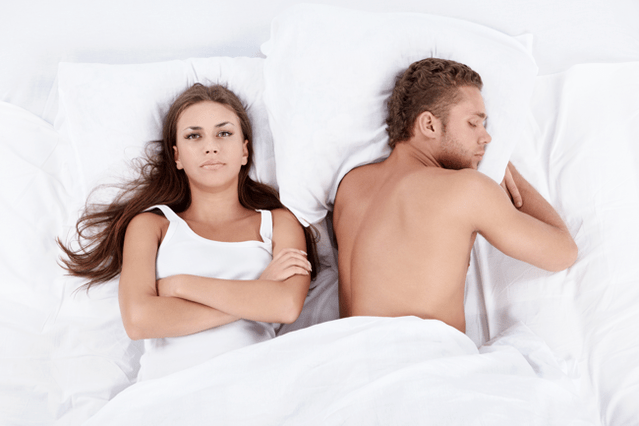 woman in bed with a man with poor potency